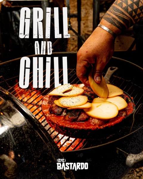 Person grilling food including meat and sliced potatoes on a barbecue grill with Grill and Chill text overlay